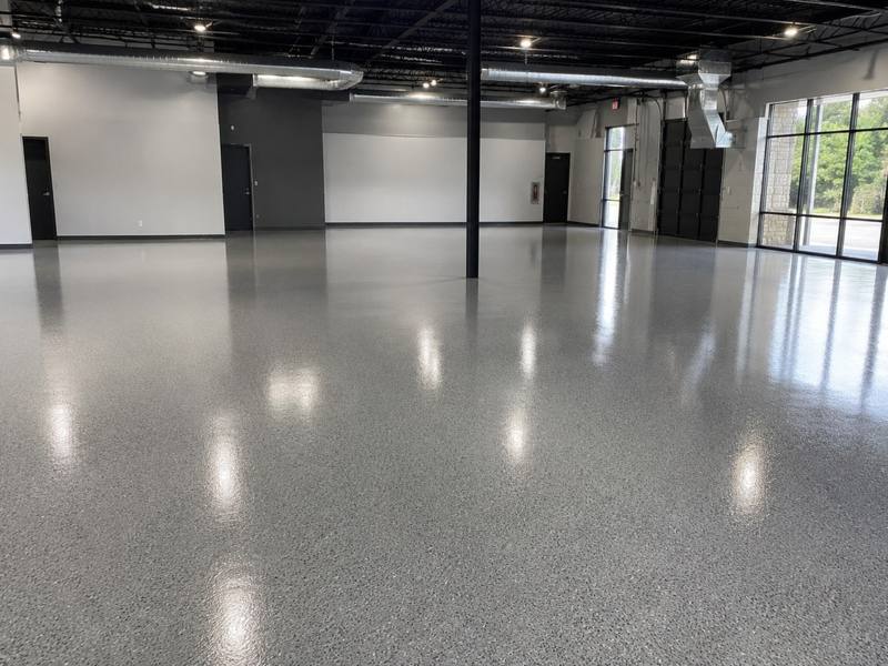 Polished grey epoxy floor in an empty commercial space in Clarington