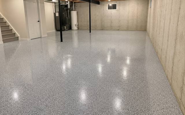 Grey flake epoxy floor in an unfinished basement in Clarington, Ontario