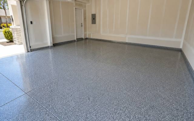 Light grey flake epoxy floor in a garage in Clarington